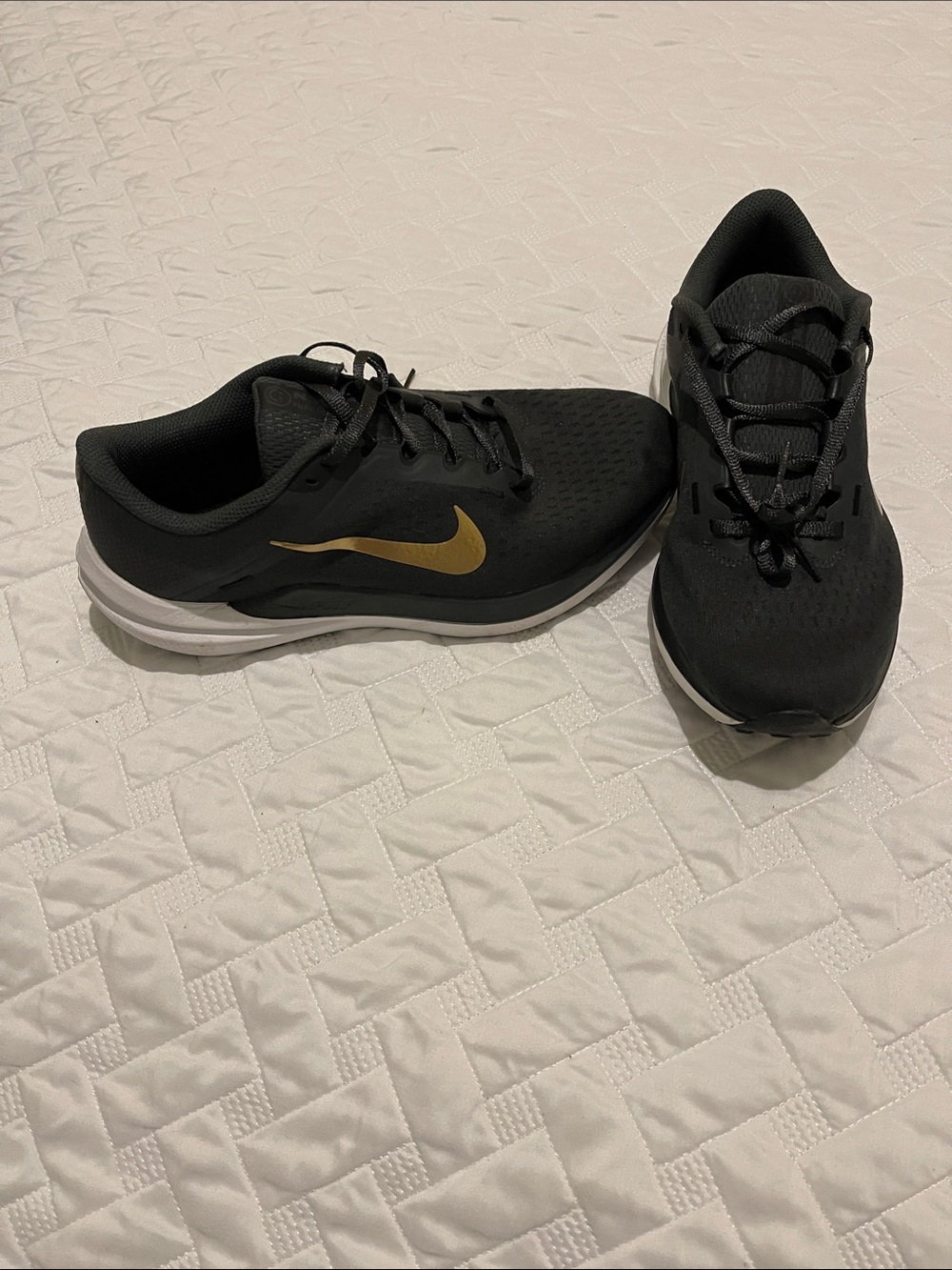 Nike Black Sneakers with Gold Swoosh and White Sole